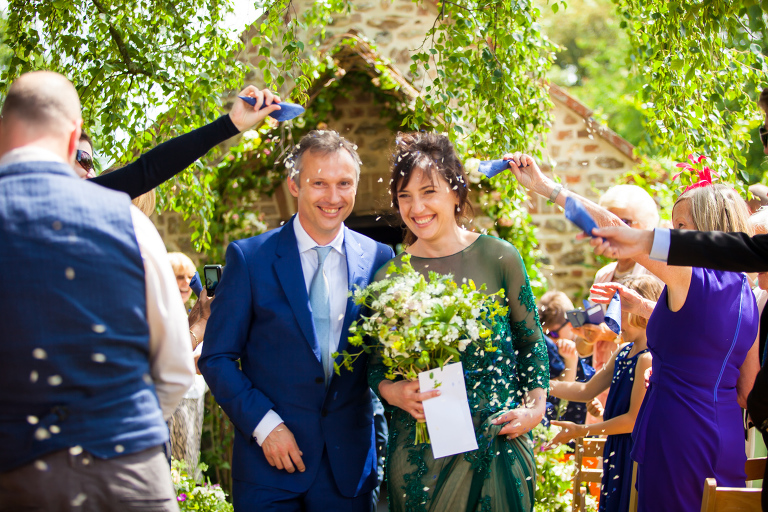 confetti shot of couple at cadhay house