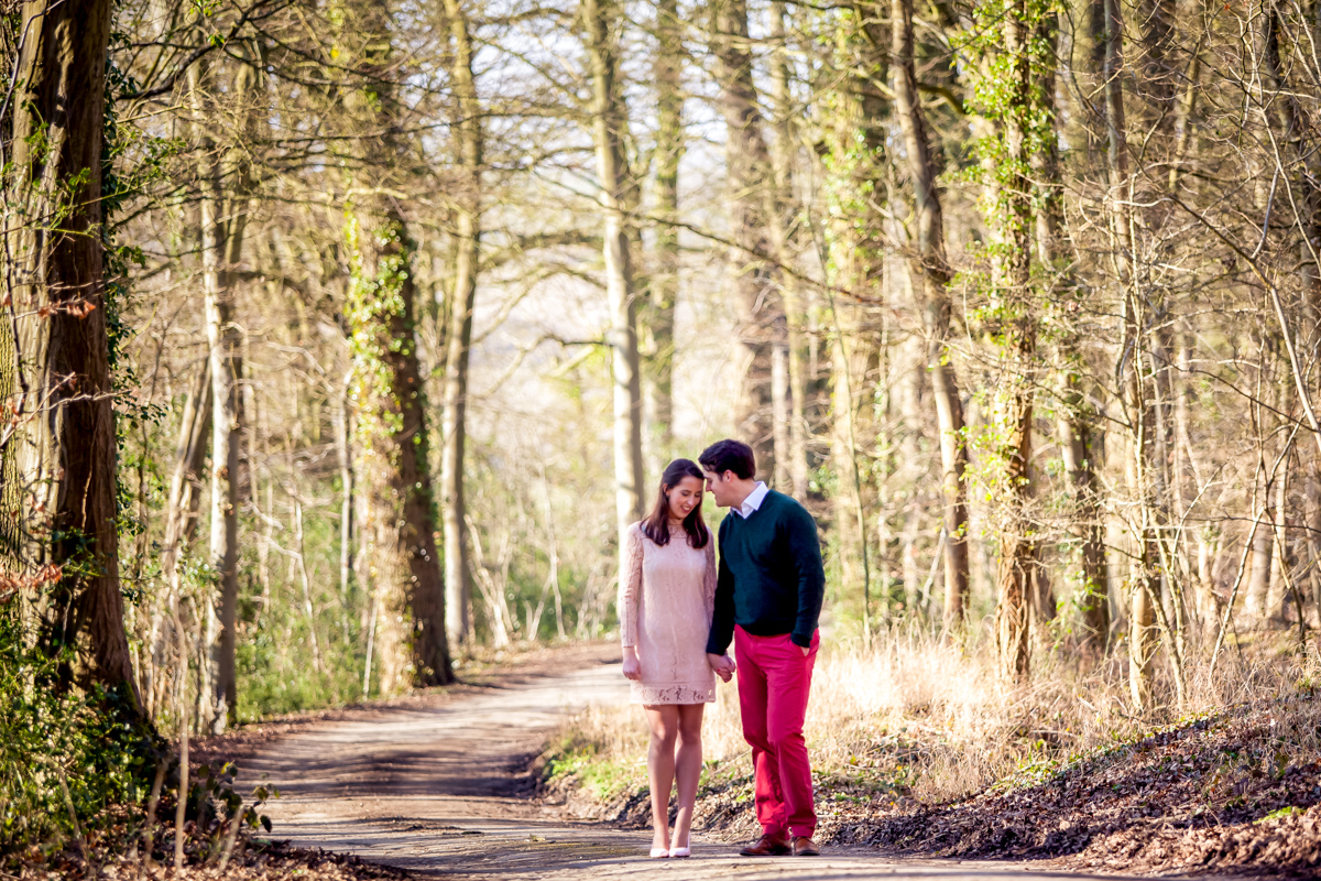 Couple holding hands in the woods
