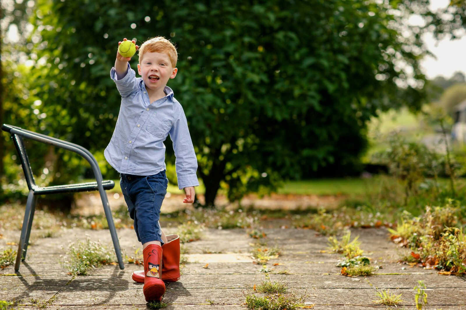Boy playing cricket in the garden